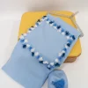 Le Coconnè Coperta Celeste con Pon Pon per Neonati